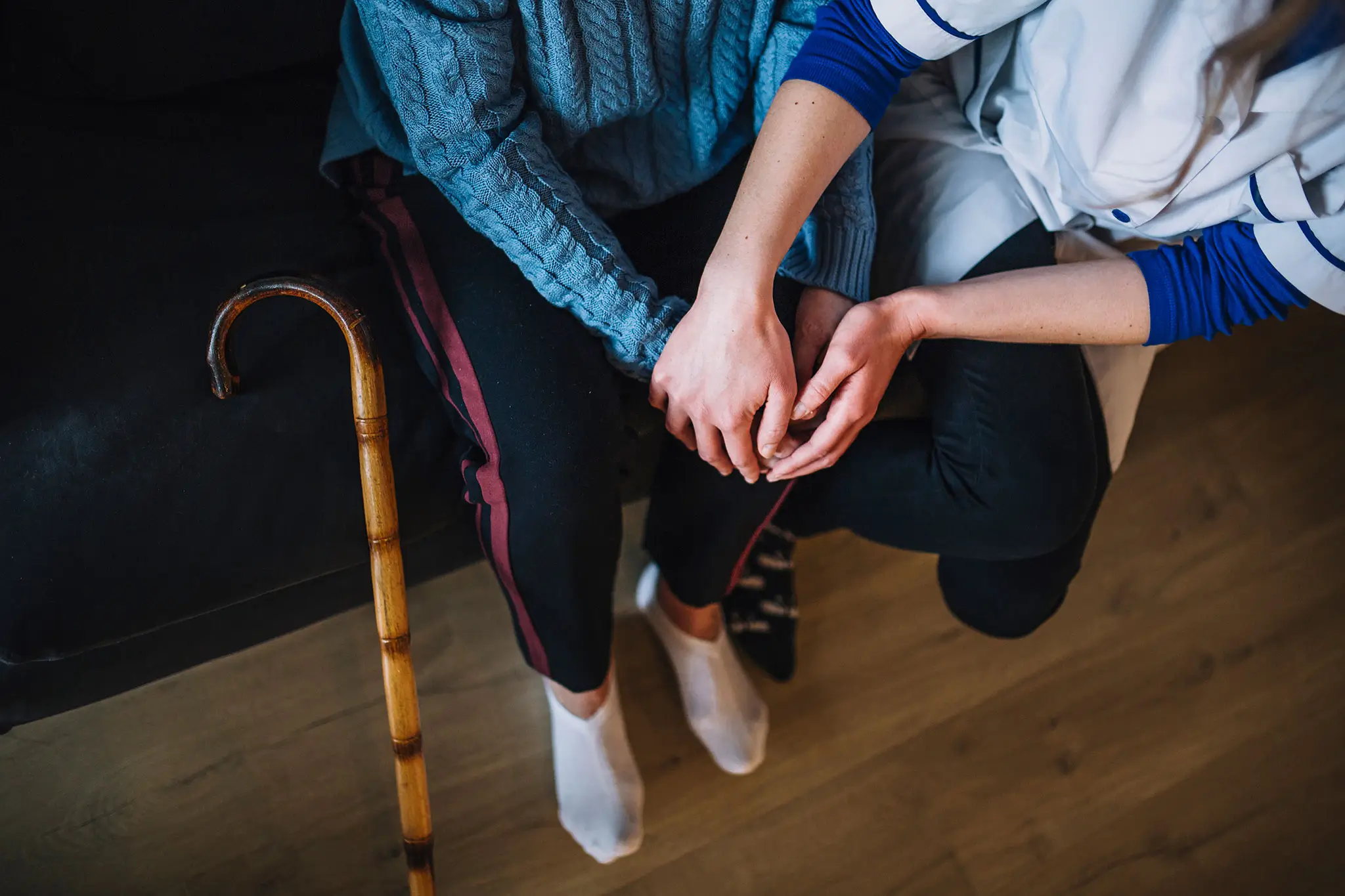 retirement-home-concept-with-nurse-and-woman-holding-hands